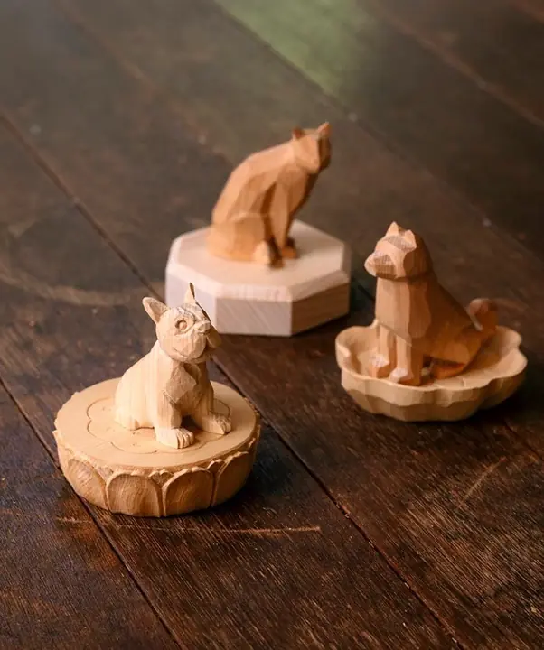 Carved cat and dogs on small bases